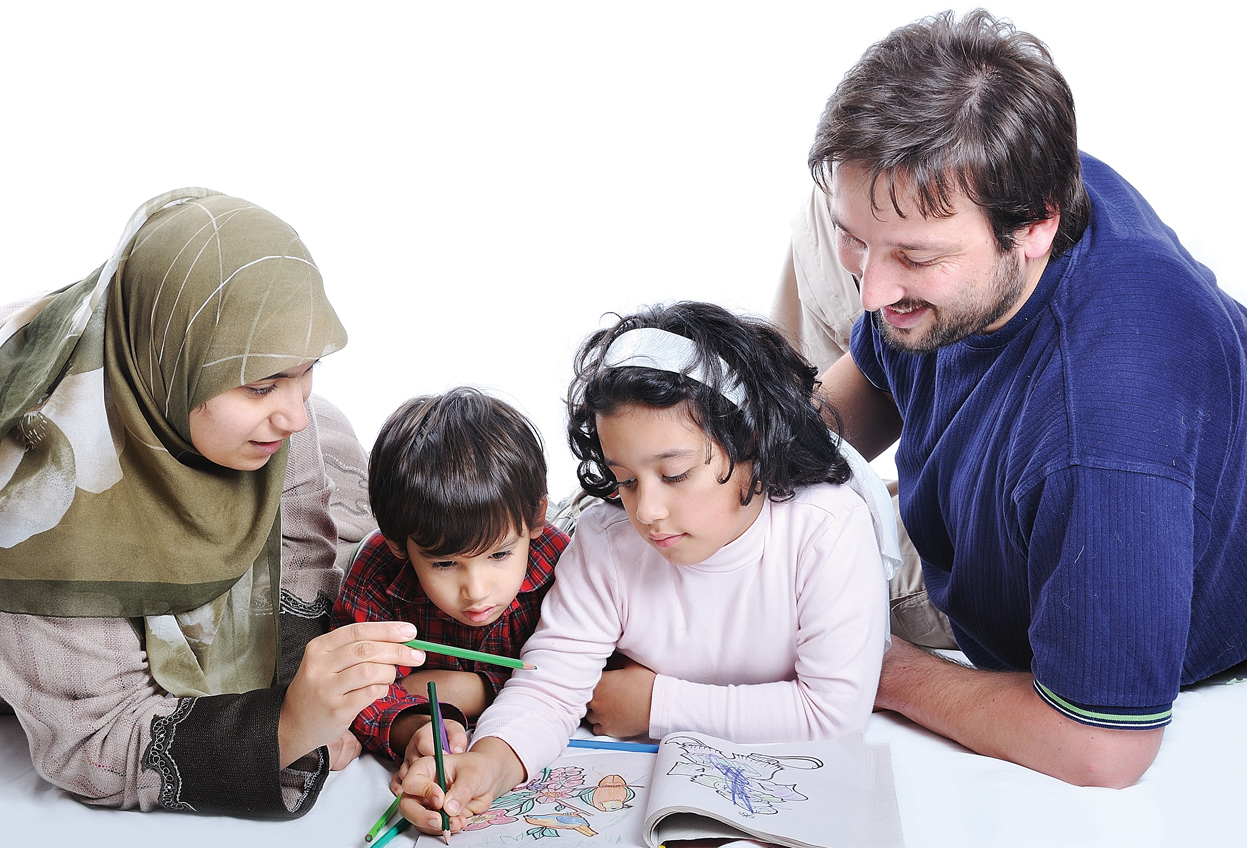 We are a Muslim family living in Canada. We have debts which we pay back with interest yet my husband wants to enroll our kids in an expensive private Islamic school. What should take a priority please?